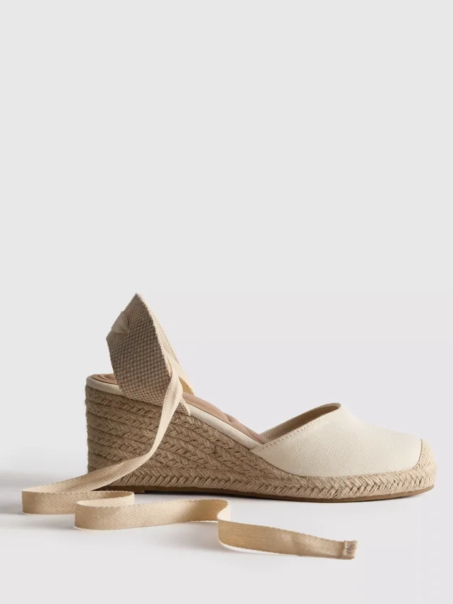 Closed toe tie up wedges