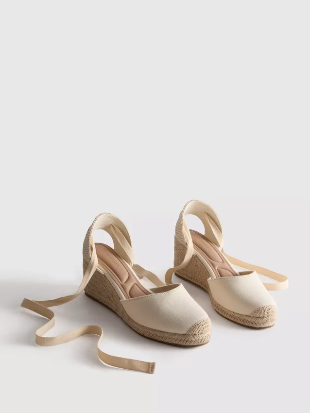 Closed toe tie up wedges
