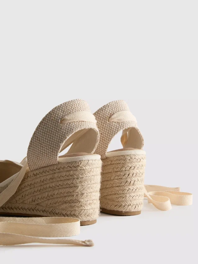Closed toe tie up wedges