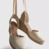 Closed toe tie up wedges