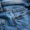 Cotton denim flared mid-rise jeans