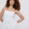 Cotton embroidered peplum hem cami top