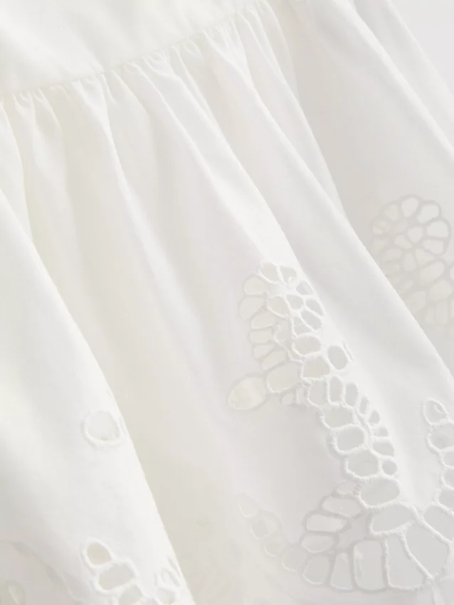 Cotton embroidered peplum hem cami top