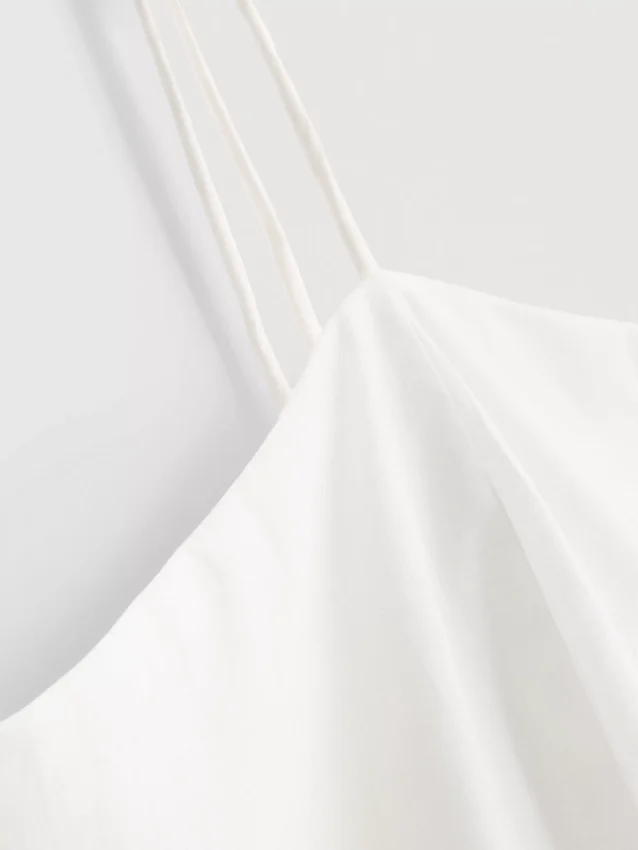 Cotton embroidered peplum hem cami top