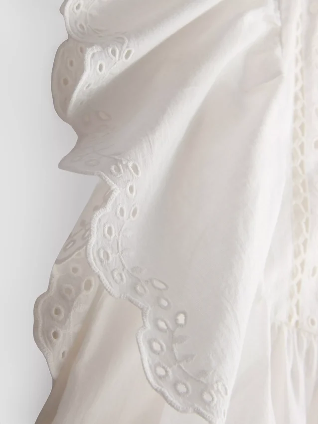 Cotton embroidered scalloped sleeve top