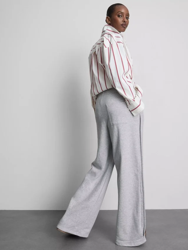 Cotton-rich wide-leg pleated joggers