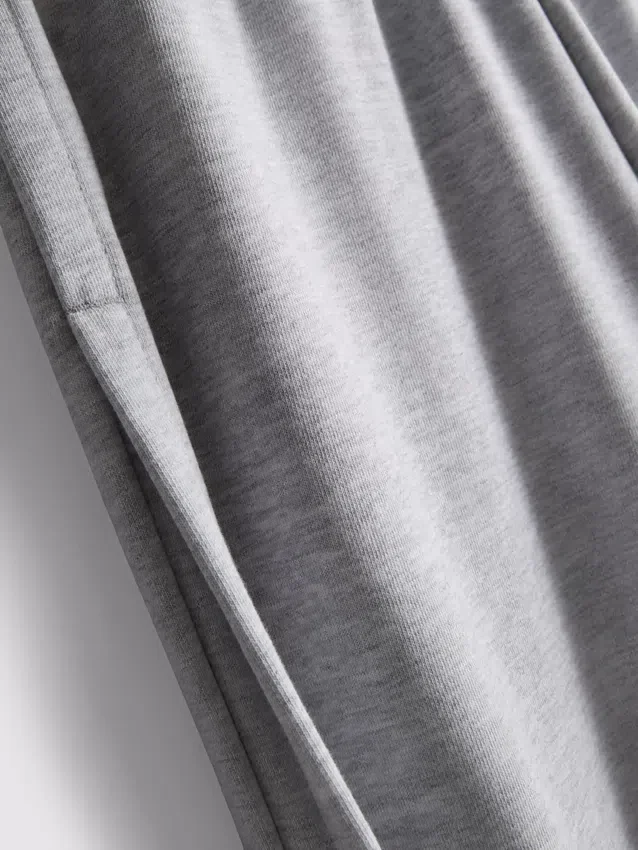 Cotton-rich wide-leg pleated joggers