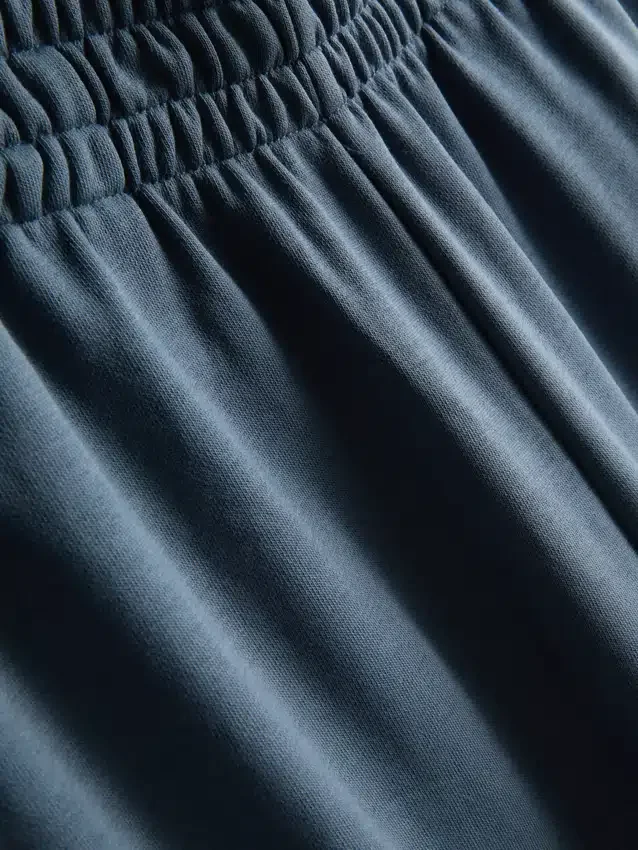 Cotton-rich wide-leg pleated joggers