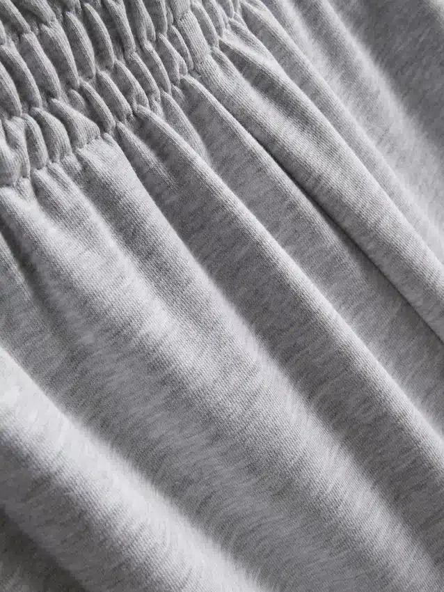 Cotton-rich wide-leg pleated joggers