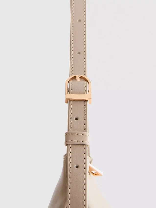 Curved faux leather shoulder bag