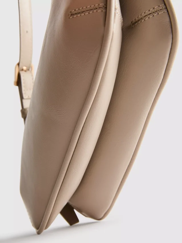 Curved faux leather shoulder bag