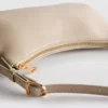 Curved faux leather shoulder bag