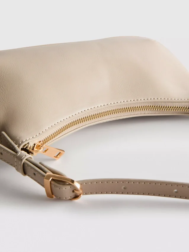 Curved faux leather shoulder bag