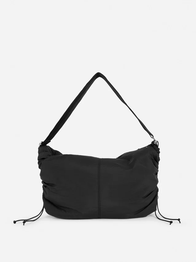 Drawstring detail sling bag
