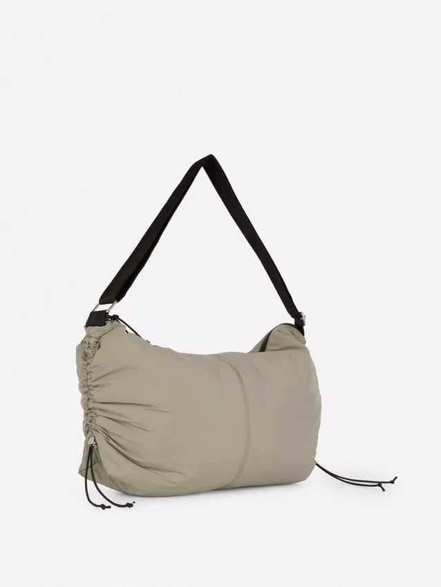 Drawstring detail sling bag