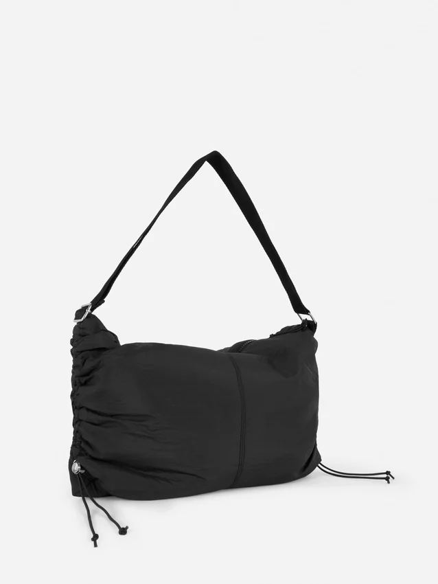 Drawstring detail sling bag