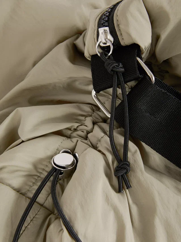 Drawstring detail sling bag