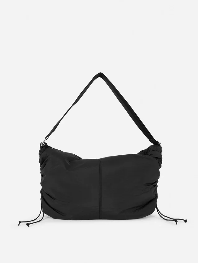 Drawstring detail sling bag