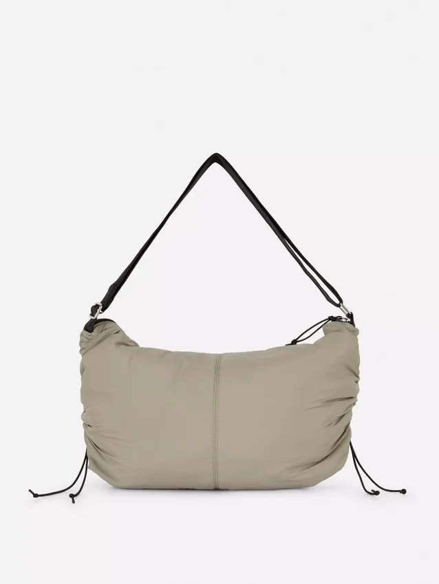 Drawstring detail sling bag