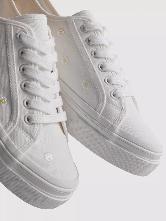 Embroidered daisy sneakers