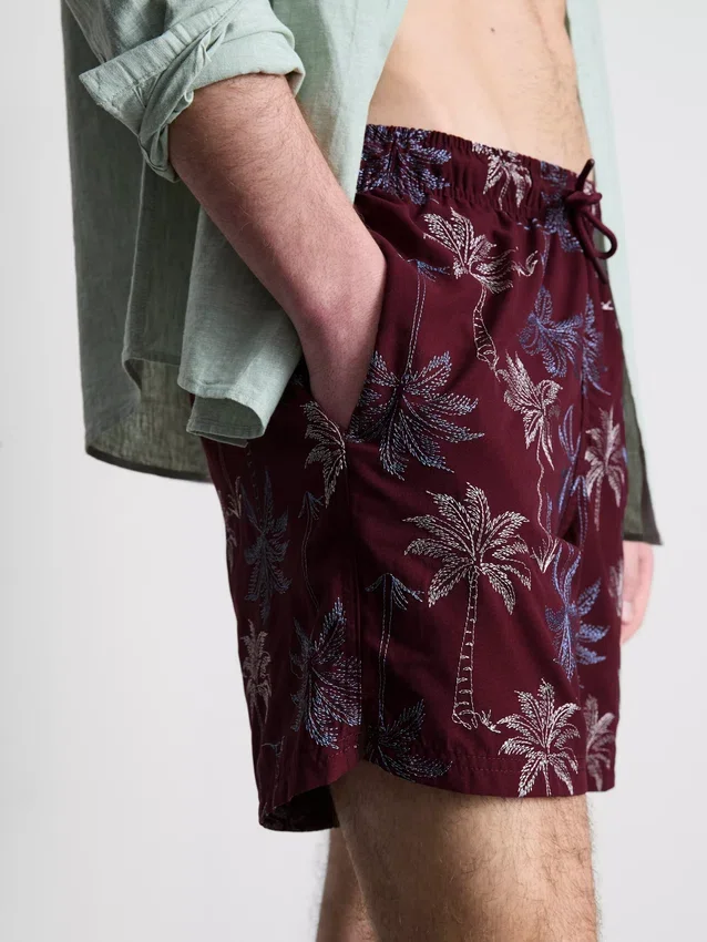 Embroidered palm tree swimming shorts