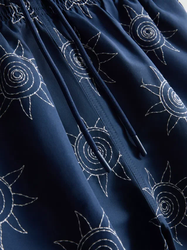 Embroidered sun swimming shorts