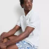 Fish embroidered revere collar shirt