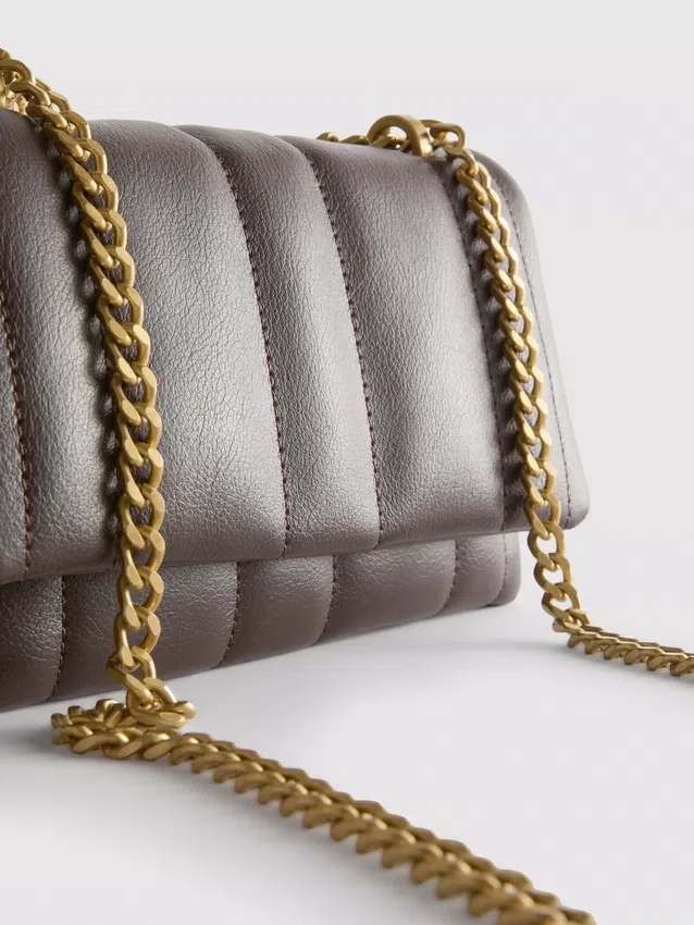 Flap-over panel crossbody bag