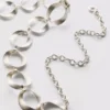 Oval link chain belt
