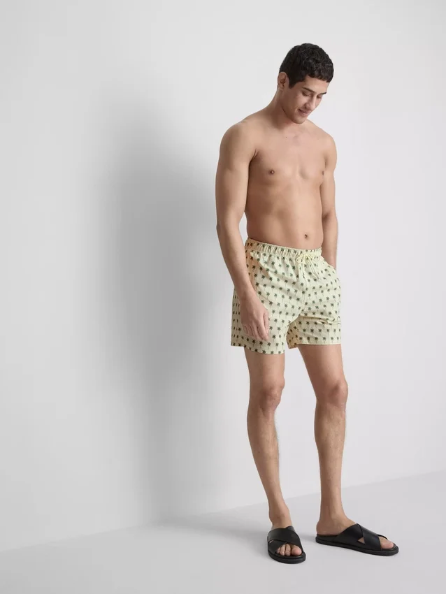 Palm tree textured swimming shorts