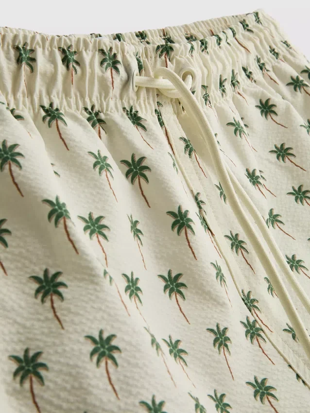 Palm tree textured swimming shorts