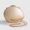 Paula echevarría metallic oval crossbody bag