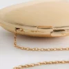Paula echevarría metallic oval crossbody bag