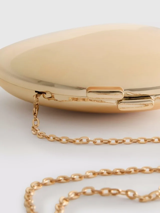 Paula echevarría metallic oval crossbody bag
