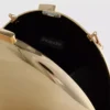Paula echevarría metallic oval crossbody bag