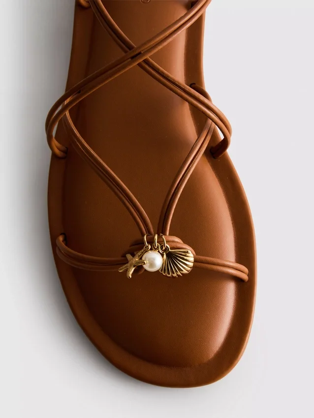 Paula echevarría strappy charm sandals