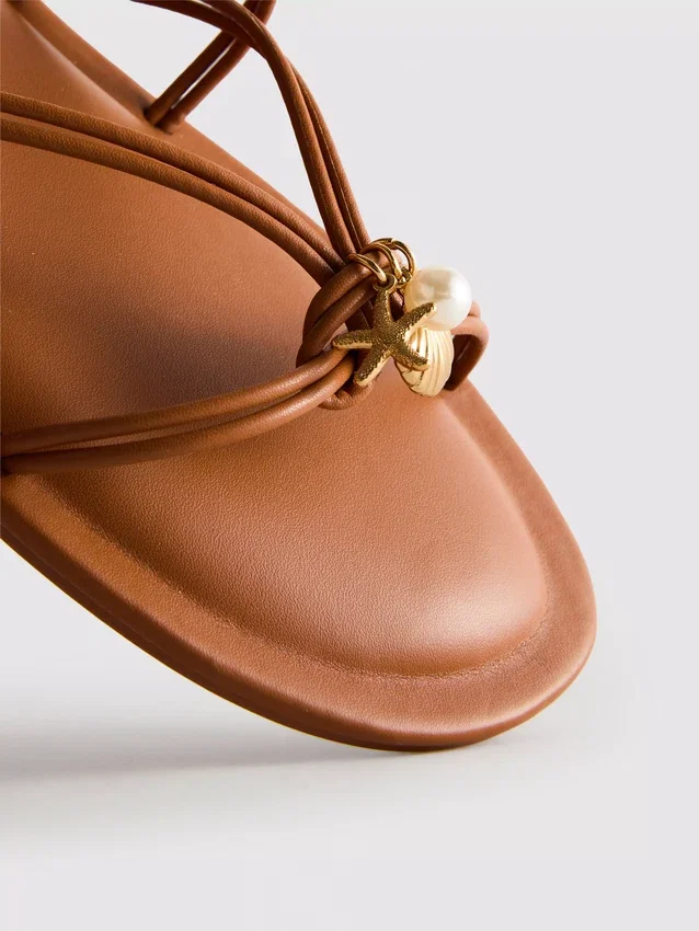 Paula echevarría strappy charm sandals
