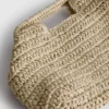 Paula echevarría woven crossbody bag