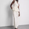 Polka dot halter neck peplum top