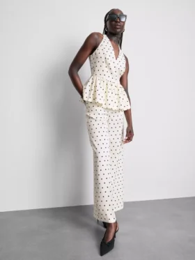 Polka dot halter neck peplum top
