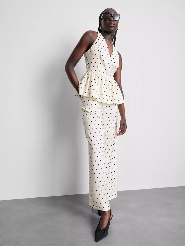 Polka dot halter neck peplum top