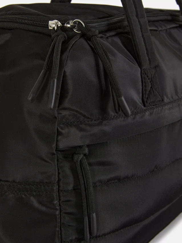 Quilted under seat cabin bag