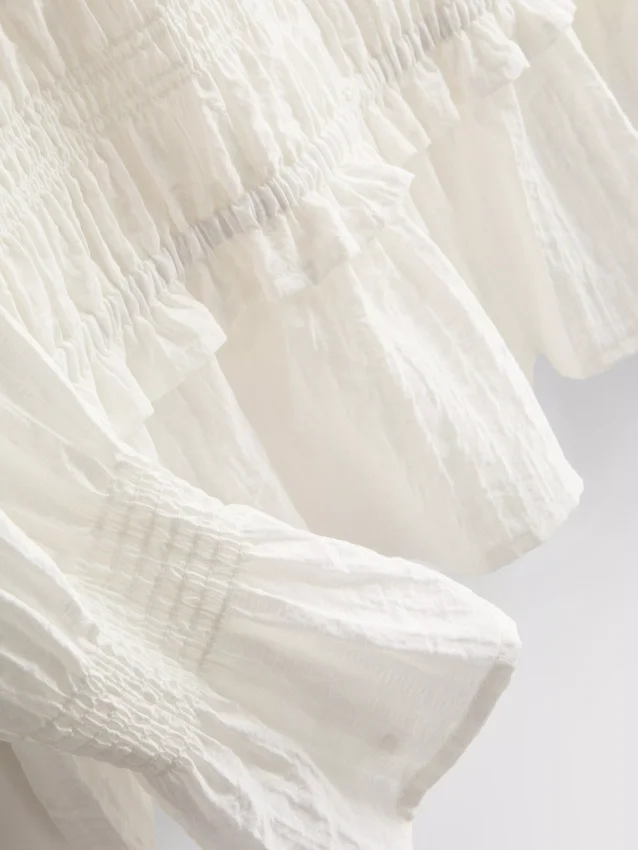 Shirred peplum hem blouse