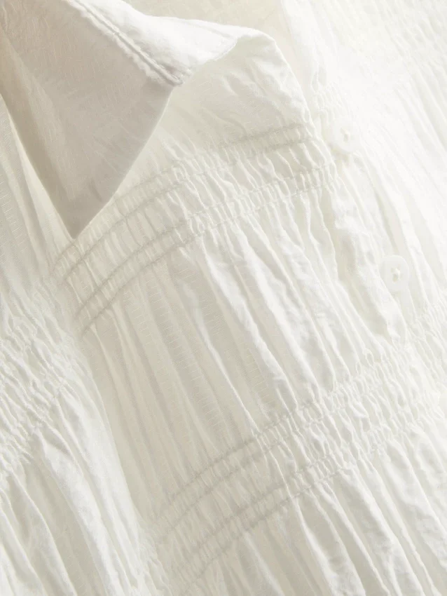 Shirred peplum hem blouse