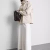 Short cinched rain jacket