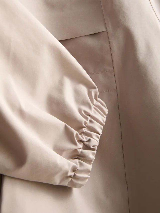 Short cinched rain jacket