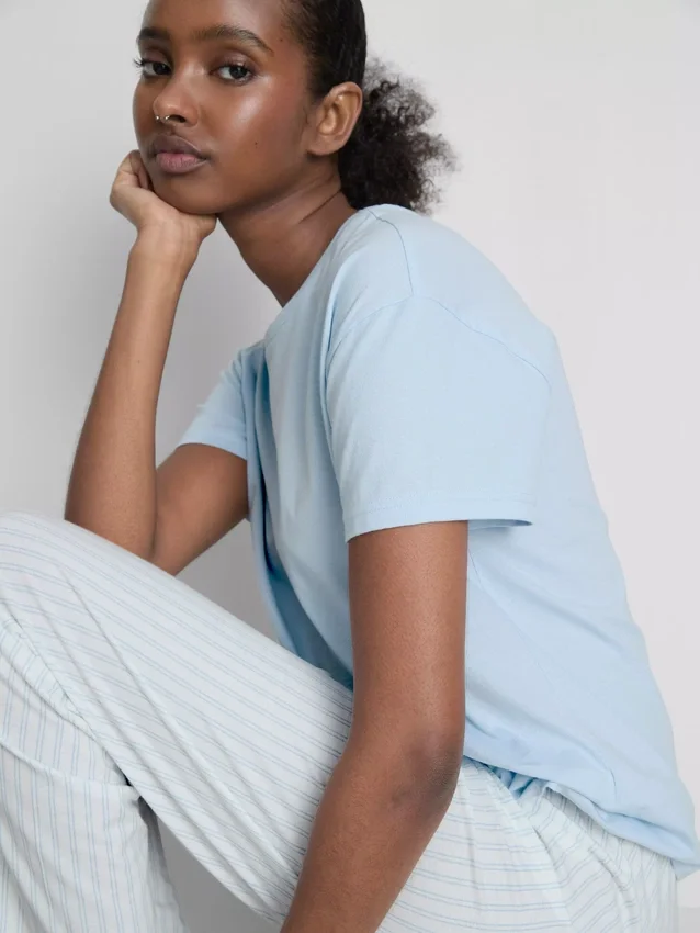 T-shirt and striped-bottom pajamas
