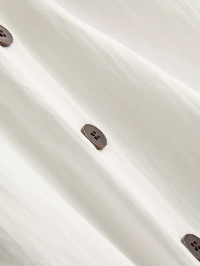 Textured button through halterneck top