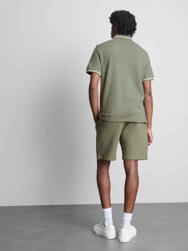Textured zip-neck polo shirt