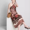 The edit linen-blend printed halter midi dress